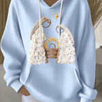 Light blue ribbed women’s hoodie with embroidered nativity scene, hood and drawstrings
