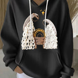 Black ribbed women’s hoodie with embroidered nativity scene and drawstring hood