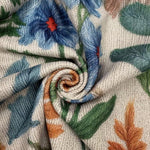 Floral knit cardigan fabric with embroidered leaf and flower motifs