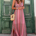 Red halterneck maxi dress with zigzag tribal pattern, V-neck and flowing skirt