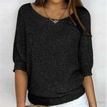 Eunice™ knit top in black; relaxed fit, boat neckline, elbow-length sleeves, ribbed cuffs.