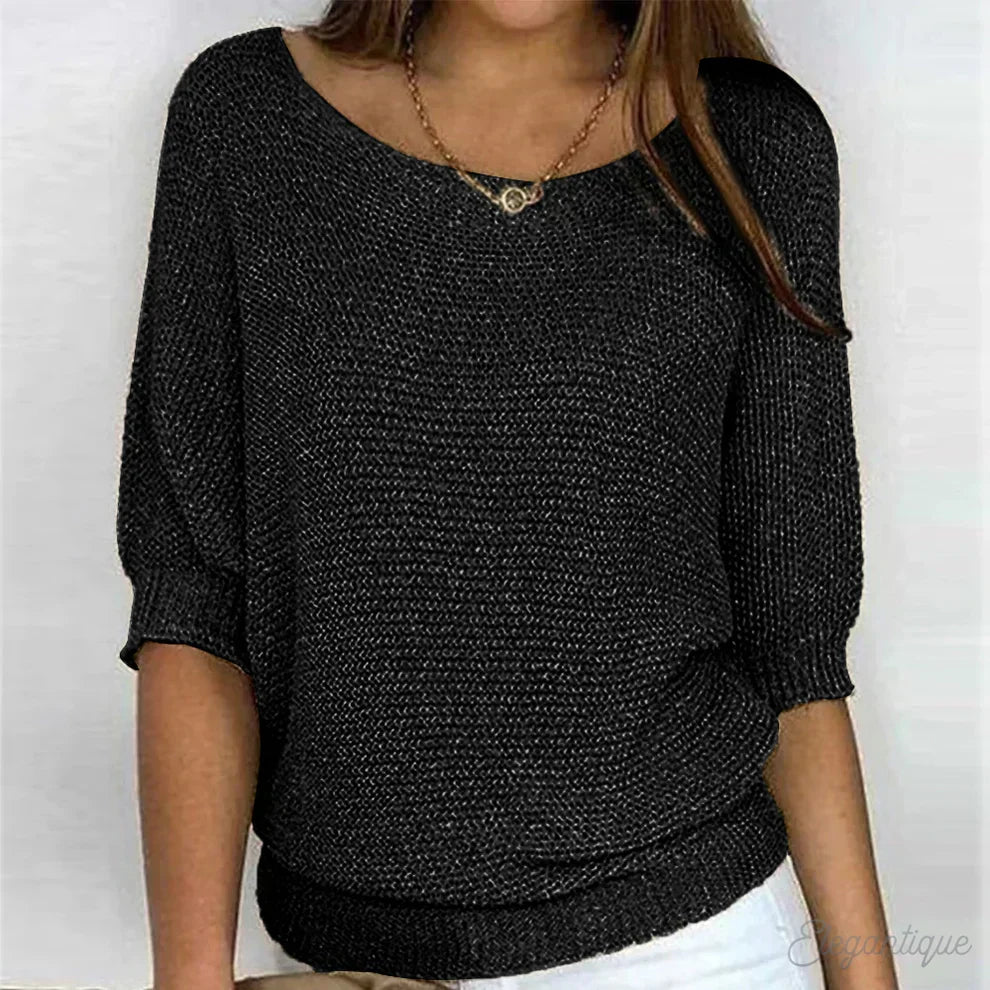 Eunice™ knit top in black; relaxed fit, boat neckline, elbow-length sleeves, ribbed cuffs.