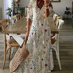 Boho midi dress in white with multicolor wildflower print, short sleeves and tiered skirt