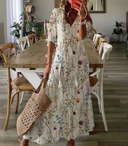 Boho midi dress in white with multicolor wildflower print, short sleeves and tiered skirt