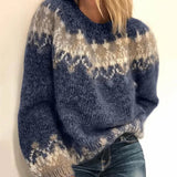 Blue fair isle knit sweater close-up with cream patterned yoke and ribbed cuff