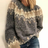 Blue fair isle knit sweater close-up, crew neck and patterned sleeve cuff