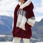 Fuzzy winter coat, deep red with cream striped panels and hooded zip closure
