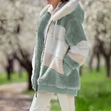 Fuzzy winter coat, mint green with cream striped panels and hooded zip closure