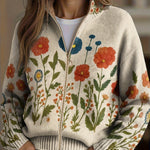 Floral knit cardigan with full zip, front pockets, cream base, orange and blue flowers