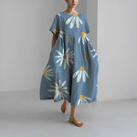 Women's floral dress, dusty blue base with white daisy and yellow center print, midi length