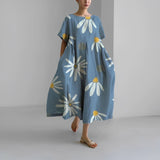 Women's floral dress, dusty blue base with white daisy and yellow center print, midi length