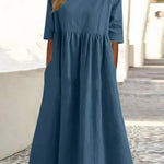 Blue cotton round-neck dress with short sleeves and gathered waist