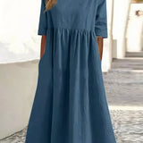 Blue cotton round-neck dress with short sleeves and gathered waist