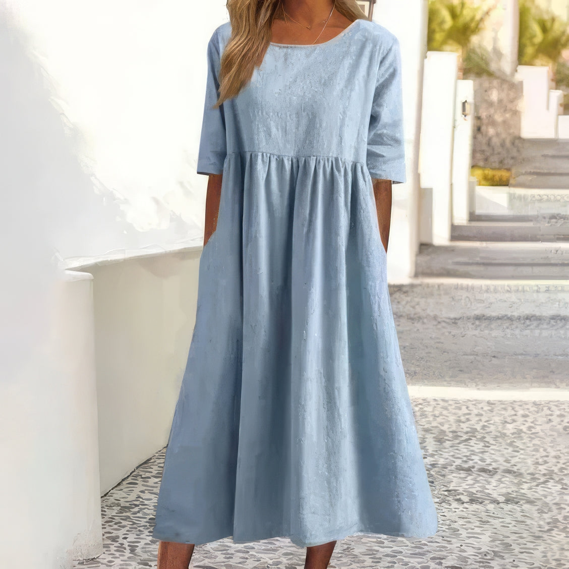Sky blue cotton round-neck dress with short sleeves and gathered waist