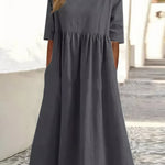 Dark gray cotton round-neck dress with short sleeves and gathered waist