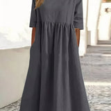 Dark gray cotton round-neck dress with short sleeves and gathered waist