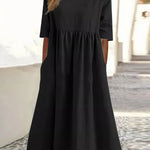 Black cotton round-neck dress with short sleeves and gathered waist