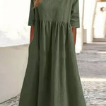 Green cotton round-neck dress with short sleeves and gathered waist