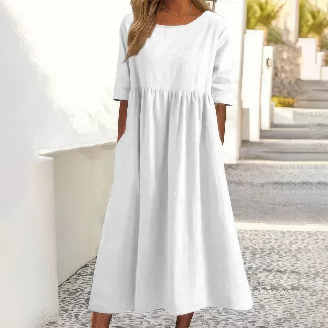 White cotton round-neck dress with short sleeves and gathered waist