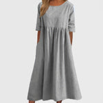 Light gray cotton round-neck dress with short sleeves and gathered waist